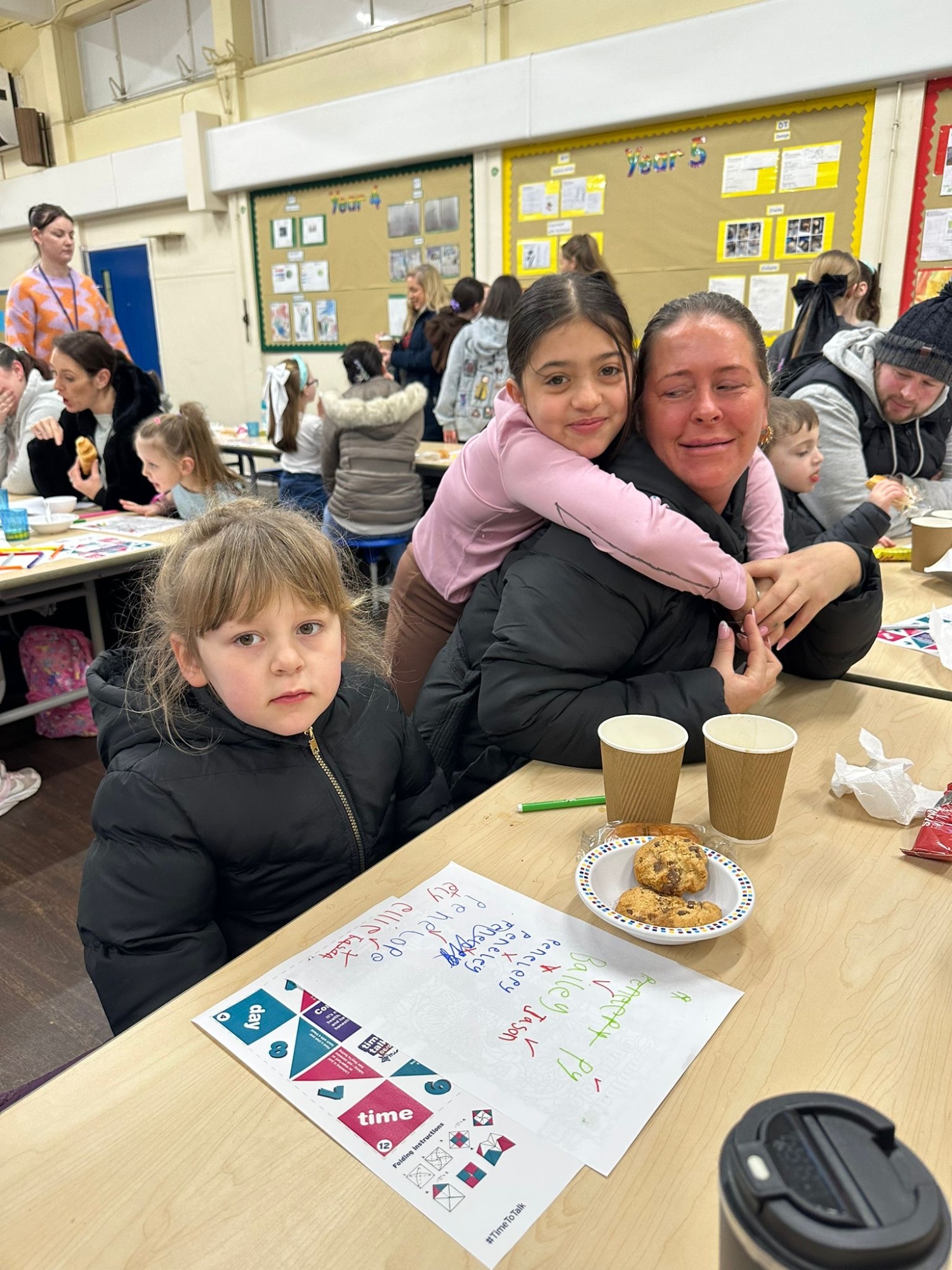 picture of children and adults enjoying the family breakfast