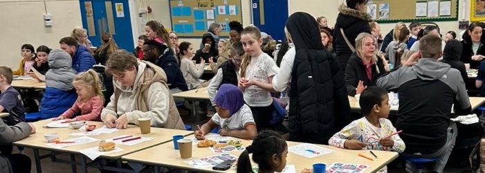 picture of children and adults enjoying the family breakfast